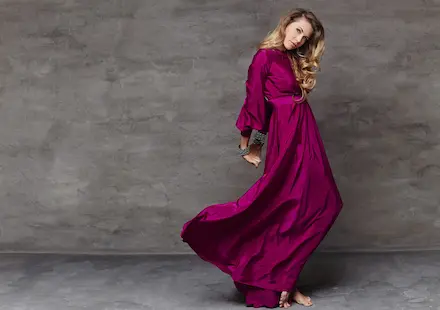 blond female dancing long red dress